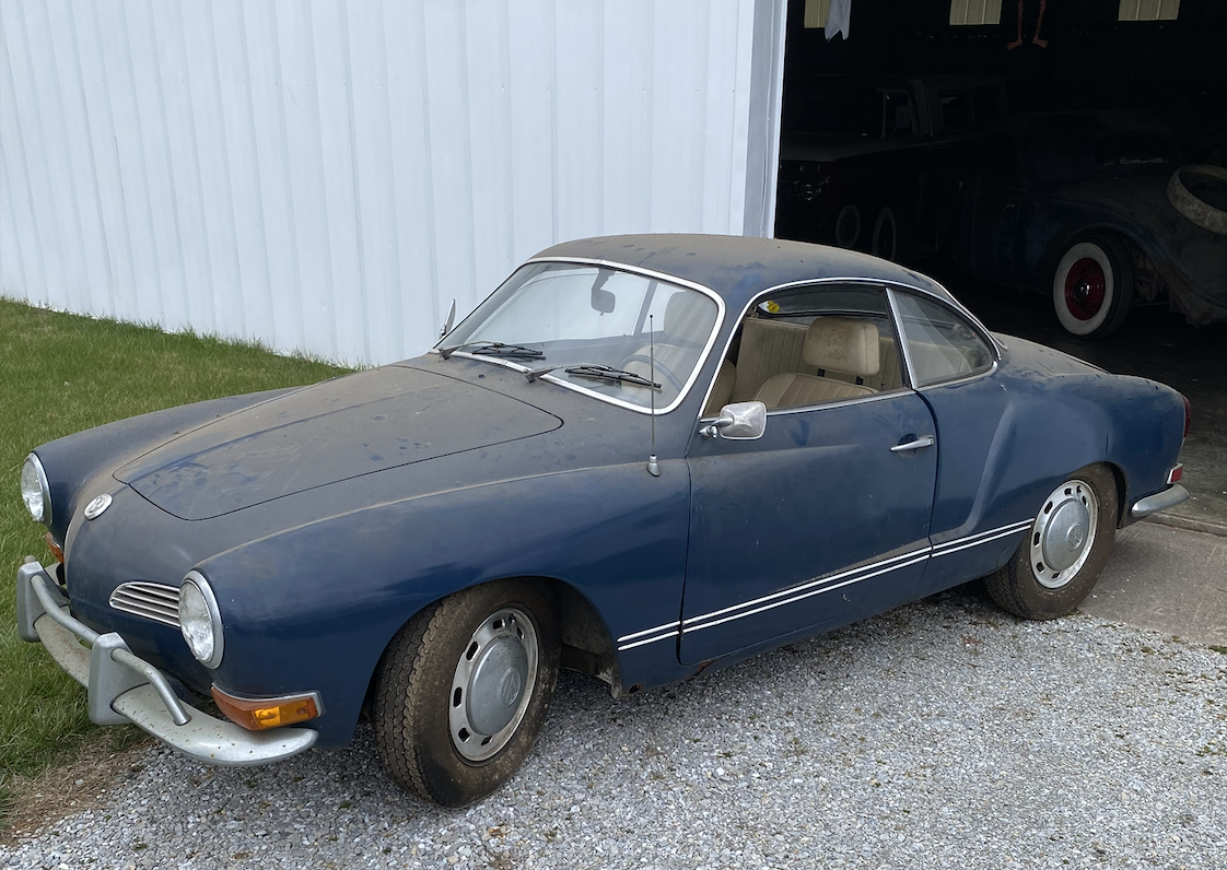 1971 Volkswagen Karmann Ghia parked outside before restoration work.