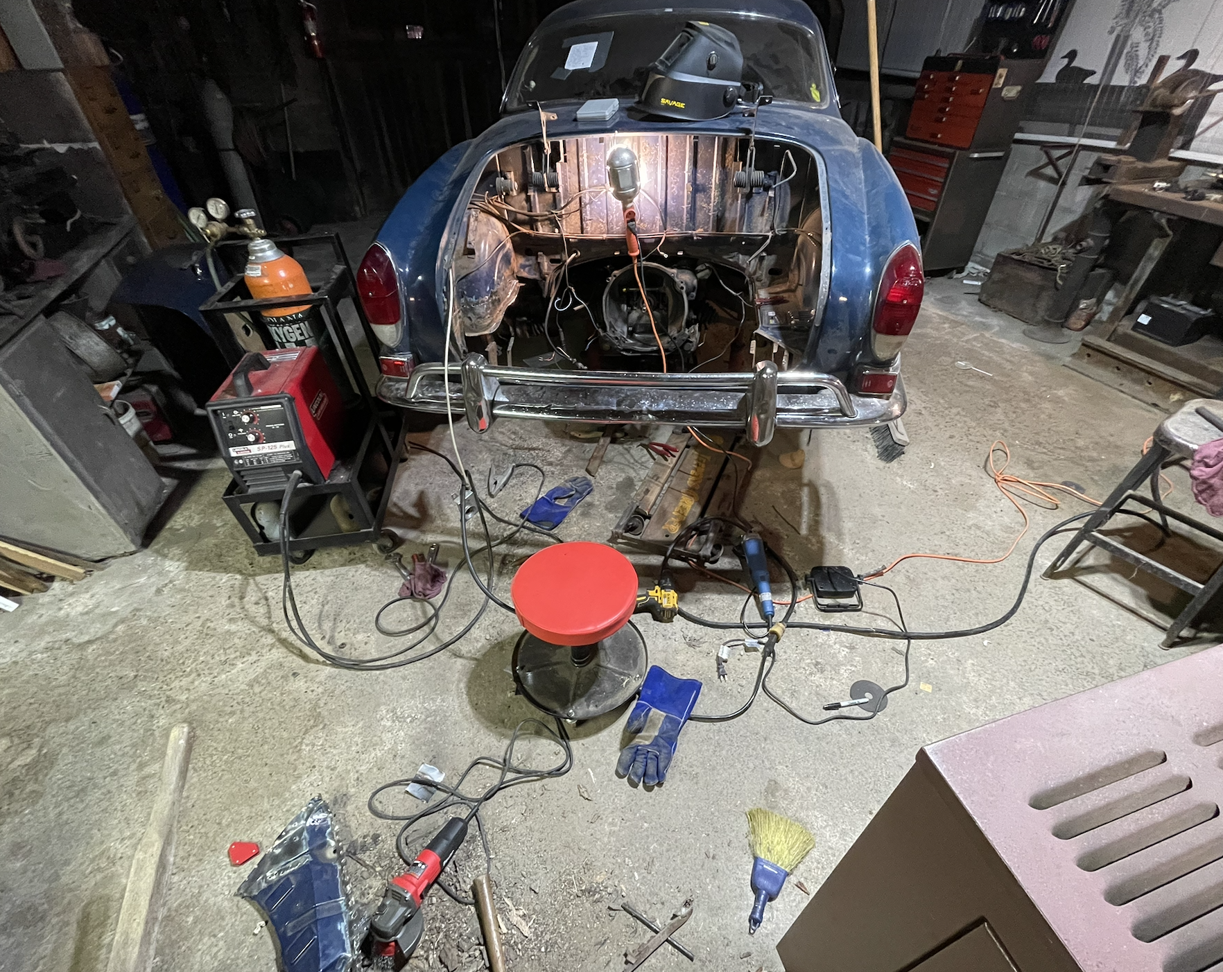 Karmann Ghia engine bay work in progress inside the shop.